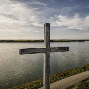 Cross Overlooking River Landscape
